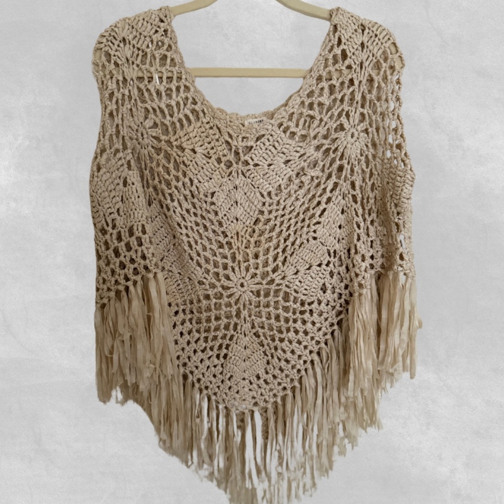 Crochet poncho with fringe detail